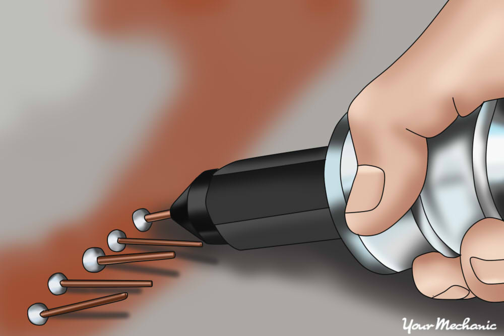 How to Fix a Dent with a Stud Welder Gun YourMechanic Advice