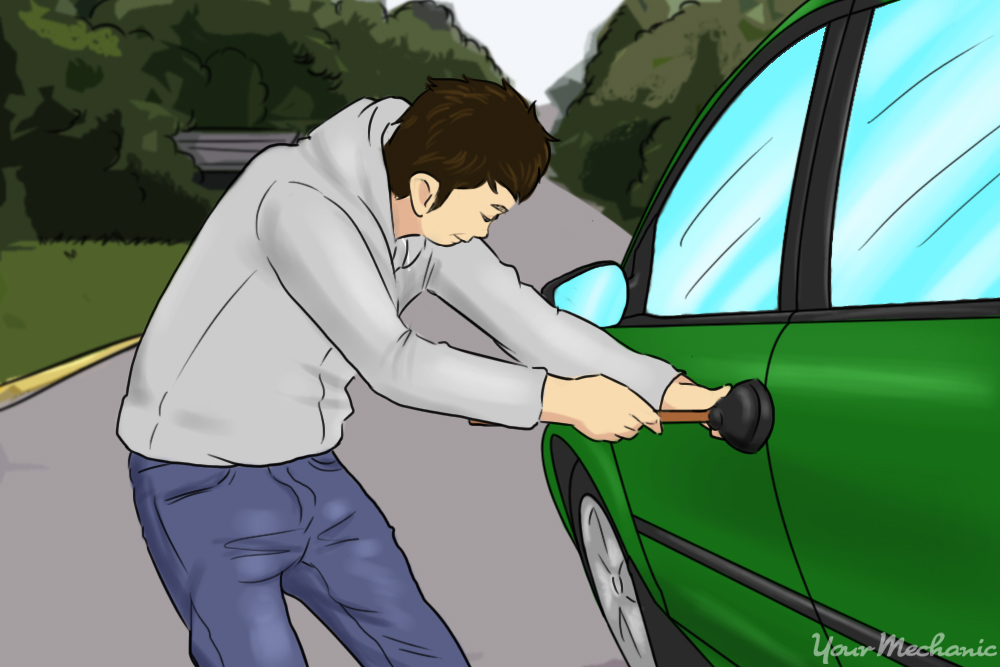 person trying to set of alarm with tool